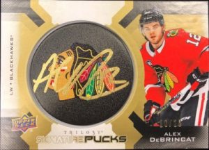 Signature Pucks Alex DeBrincat